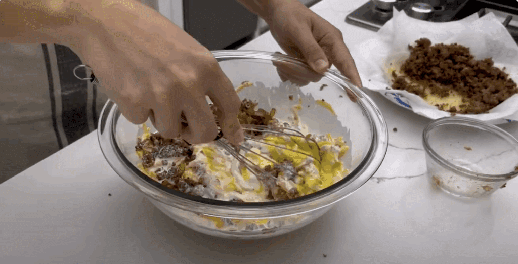 a person mixing food in a bowl